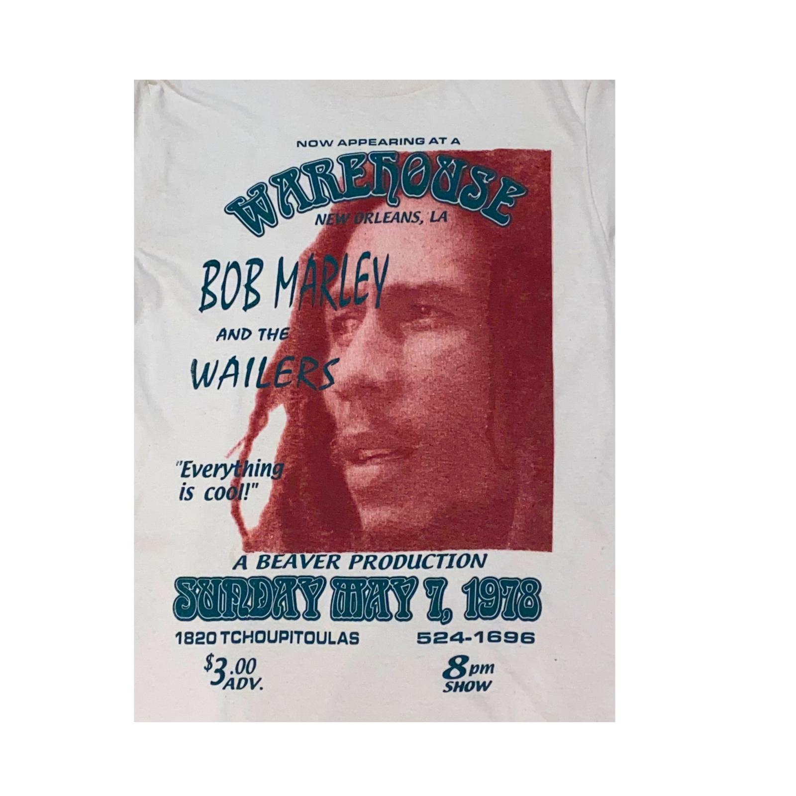 T-shirt with Bob Marley and The Wailers concert poster design on a white background