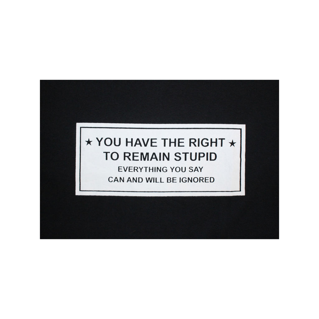 Black and white rectangular sign with text on a black background