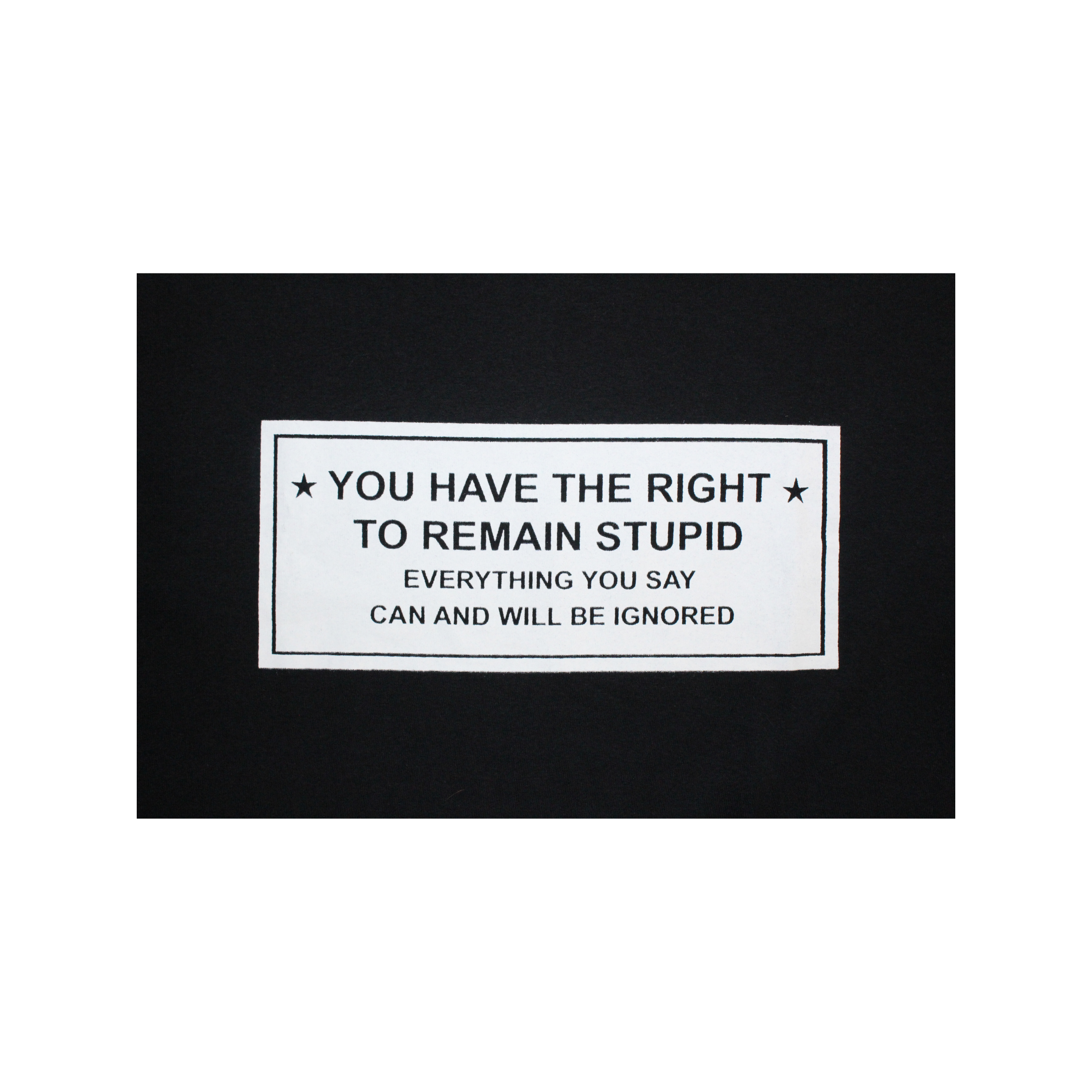 Black and white rectangular sign with text on a black background