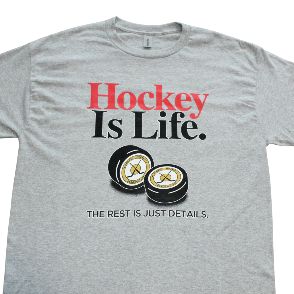 Hockey Is Life sports graphic t-shirt on black tee, front view